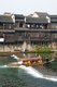 China: A tourist boat goes over a weir on the Tuo River, Fenghuang, Hunan Province